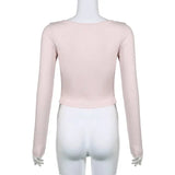 Top corto con lazo y cordones en contraste, color rosa, estilo coqueto, con pliegues ajustados y cuello en V, de punto, ideal para otoño.